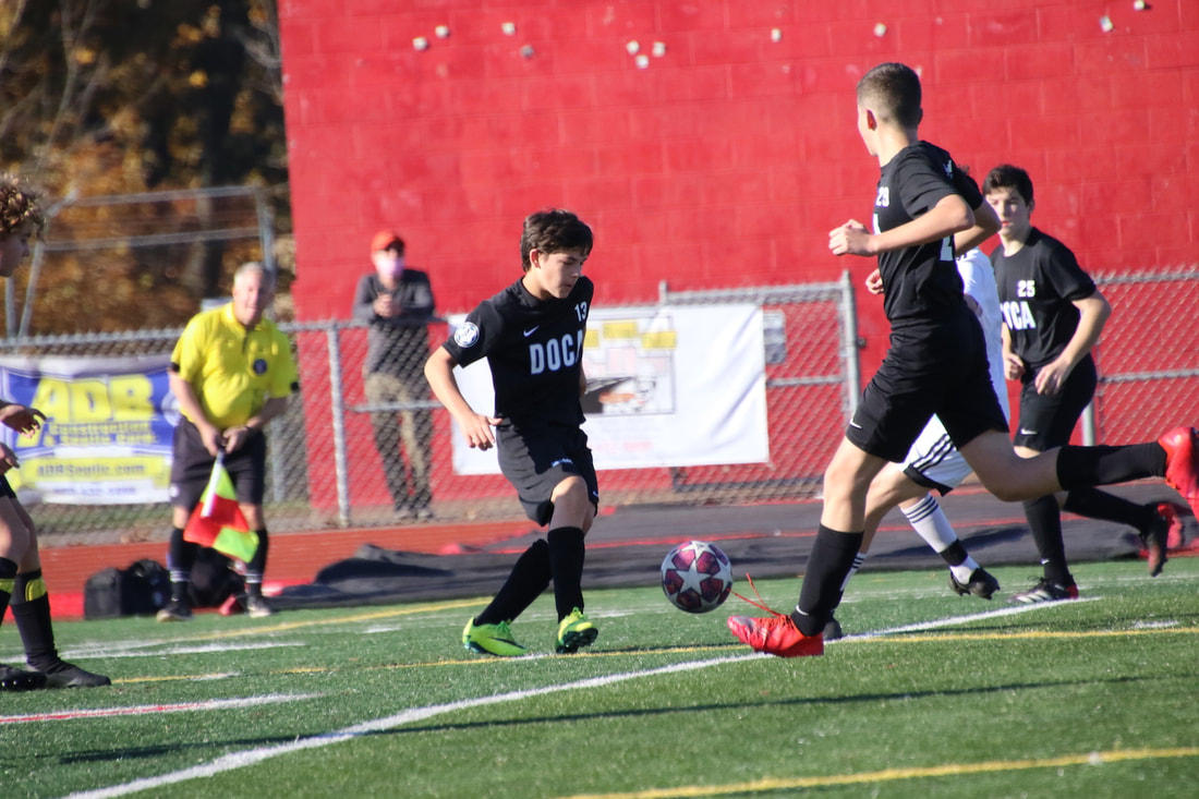 DOCA players progressing the ball together during a match
