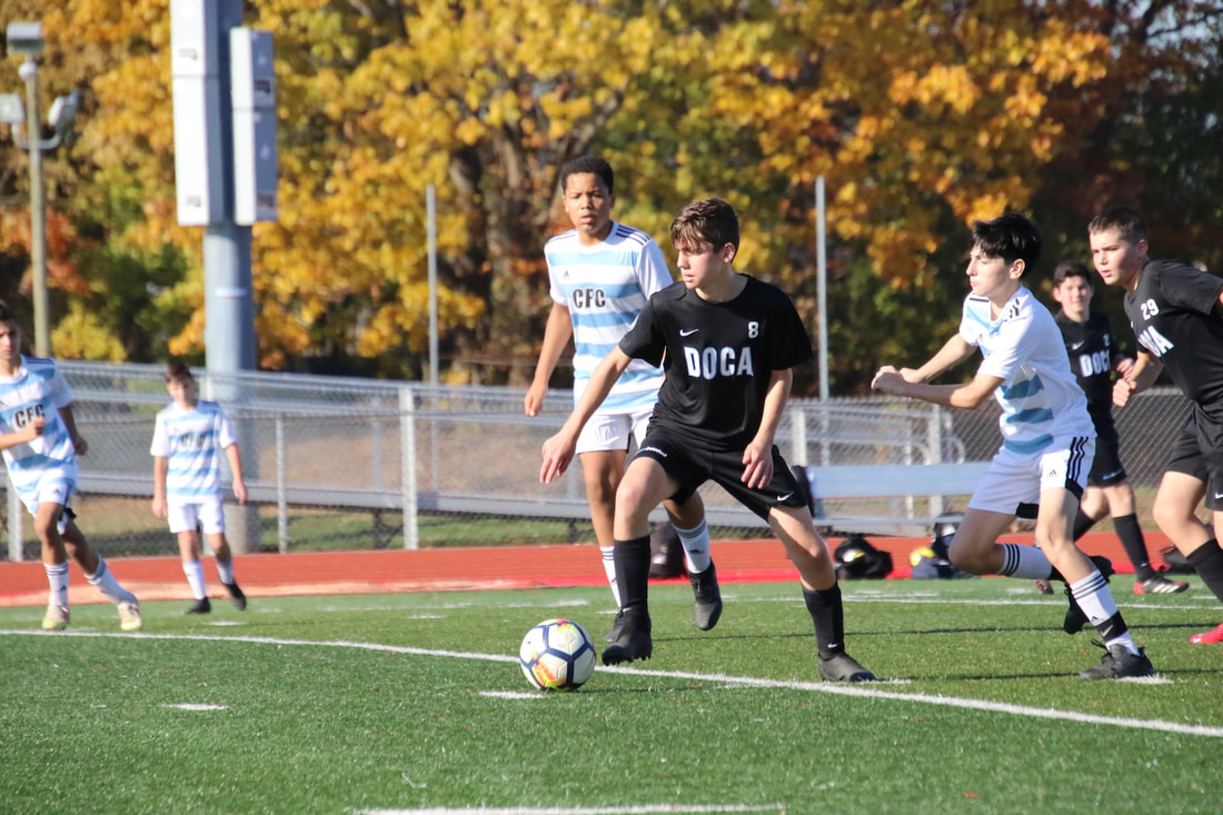 DOCA player controlling the ball under pressure